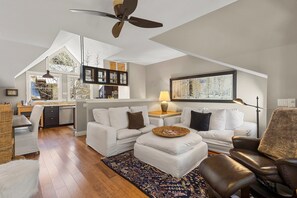 This multi-level unit features a private deck, garage parking, and is within walking distance to everything, offering both convenience and comfort.