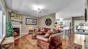 leather sofas in upper main living room by fireplace