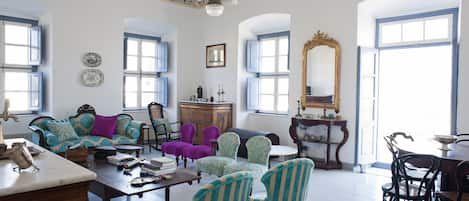 Upstairs Living room with hand painted ceiling on canvas, balcony & sea view