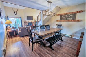 Gather with friends at large dining table for 8!  3 counter stools add seating.