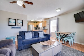 Living Room - Kitchen | Breathe Easy Rentals - This living area screams easy and convenient for living and eating. Sofa is a full size sleeper sofa.