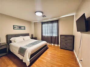 Handicap accessible bedroom immediately inside the front door of the home.