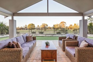 Relax in the alfresco lounge, perfectly positioned to soak in the golf course views while enjoying a drink or good conversation.