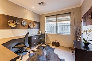  A quiet and well-appointed office space, ideal for catching up on work or enjoying a peaceful reading nook.