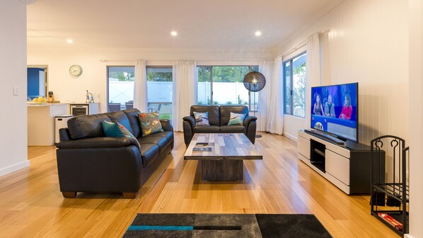 Sink into the leather sofas and binge-watch your favourite TV shows as the slow-combustion fireplace crackles for a relaxed evening.