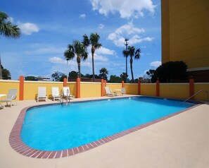 Heated swimming pool and poolside loungers