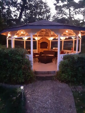 Enjoy the gazebo barbecuing cozing up to a burning fire pit.