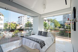 Large bedroom with glass walls. Fresh air in and out and an amazing view at all times.