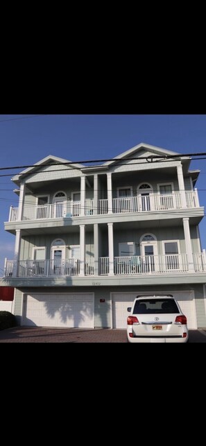 Front Beach Rd view of Condo Building.  #302 is the top right in this photo. 