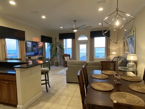The view from entry shows off the open space w/kitchen, living and dining rooms 