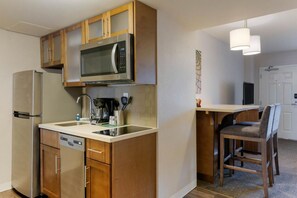 Fully equipped kitchen with a microwave, stove, oven and fridge. All utensils, plates and glasses are provided