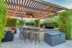 Relax outside with a built in a grill and bar