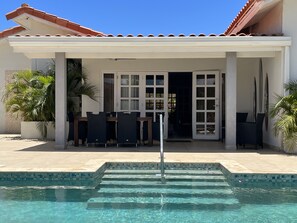 Enjoy outdoor lunch or dinner under the porch which is situated near the kitchen
