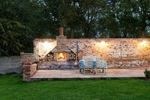 The brick chimney barbecue creates the perfect romantic alfresco dining experience