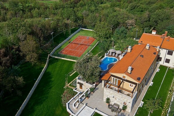 Tennis court near pool in Labin Luxury Villa for vacation and rent with pool and parking.
