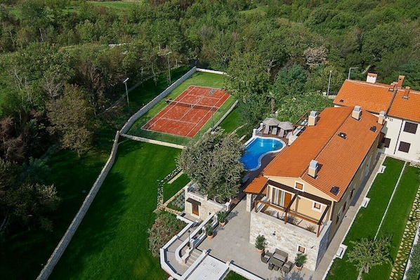 Tennis court near pool in Labin Luxury Villa for vacation and rent with pool and parking.