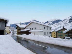 Sky, Snow, Building, Window, Slope, House, Mountain, Water, Street Light, Neighbourhood