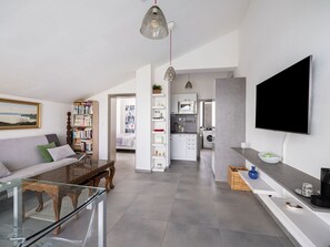 Couch, Property, Picture Frame, Furniture, Table, Building, Interior Design, Living Room, Television, Architecture