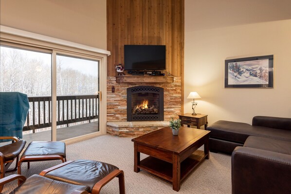 Wall mounted TV over the fireplace in the living room 