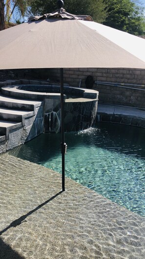 Two pool umbrellas for shade.