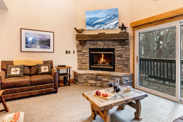 Snow Flower 156 offers a spacious living room with gas burning fireplace.