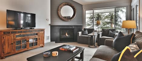 Comfortable seating in the living room with a gas fireplace
