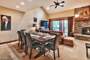 The dining area overlooks the living room and patio