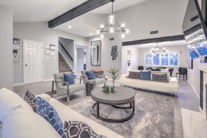 Family Room: Bright and airy space with stylish decor, perfect for relaxation and fun gatherings!