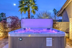 Relaxation Oasis: Savor sunset views in this inviting hot tub, perfect for unwinding after adventures!
