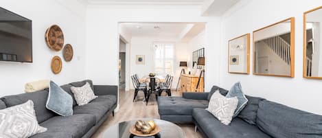 Open plan living area into dining room