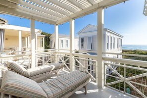 PRIVATE BALCONY WITH LOUNGE AREA, SEATING, AND GULF VIEWS