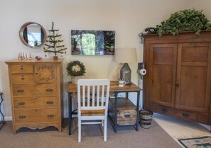 Desk area and bureau for storage. 