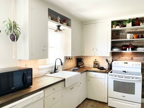 kitchen with dishwasher, microwave, stove/oven, refrigerator