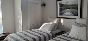 The twin bedroom with X Long beds has an en-suite full bath with large shower.