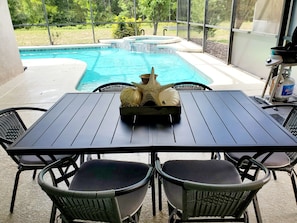 Pool Patio with seating area and complimentary BBQ Gas Grill 