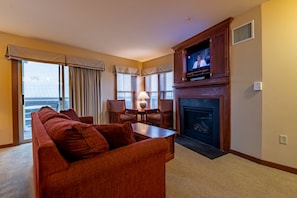 LIVING AREA WITH TV AND FIREPLACE