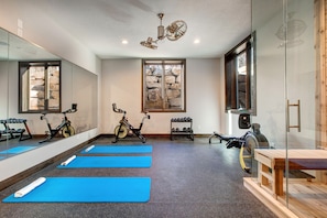 Yoga room with stationary bikes and weights