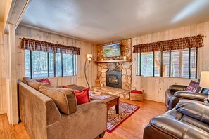 Living room features a gas fireplace, TV and plenty of room to gather!