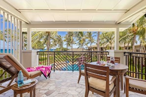 Lanai has views of the pool and distant ocean