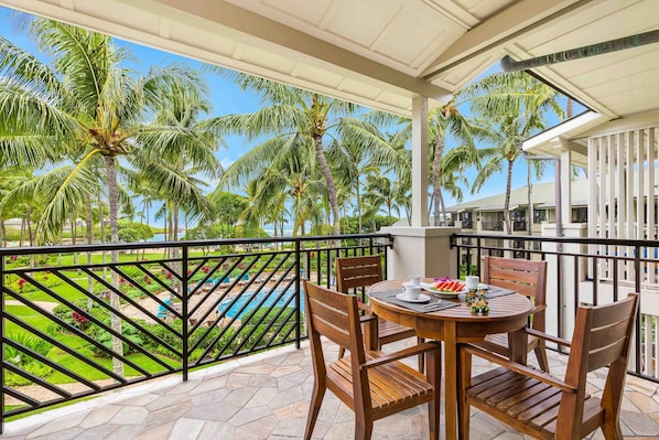 Lanai has views of the pool and distant ocean