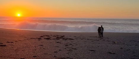 Watch the sun set over the Ocean at Black Sands Beach