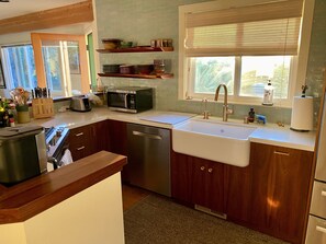 Deep farmhouse style sink and dishwasher for your convenience