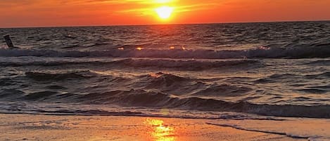 Enjoy sunset on the beach with your toes in the sand!