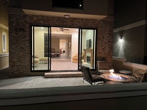 Front patio with fire pit and chairs