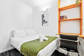 Comfortable double bed and work space 