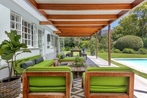 Undercover patio with lounge and dining spaces. 