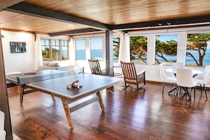 1st floor family room is game central with a ping-pong table, TV, Pacman Console