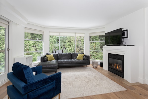 Spacious living area with beautiful bay windows