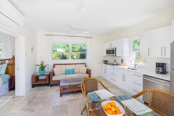 Expansive dining and living room area complemented by a fully equipped kitchen