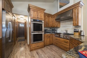 Gourmet kitchen with twin Thermador ovens, dishwasher, microwave, toaster, Thermador range/hood, kettle, coffee pot, cutlery, crock pot, etc...